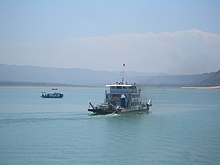 A ferry crosses the Liujiaxia Reservoir from Yongjing County to Linxia County