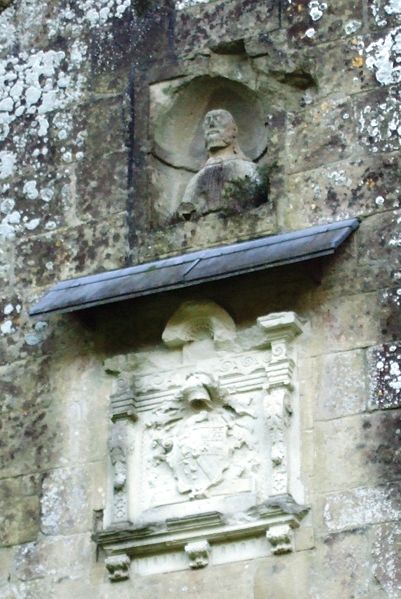 Coat of arms and head of Christ over the main entrance