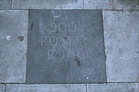 A paving stone on Kilburn High Road in London commemorates the route of Watling Street. (The date is incorrect.) Watling Street plaque Kilburn.jpg