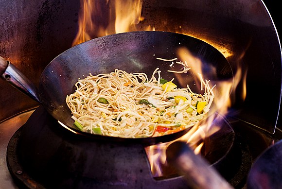 A wok being used for stir frying