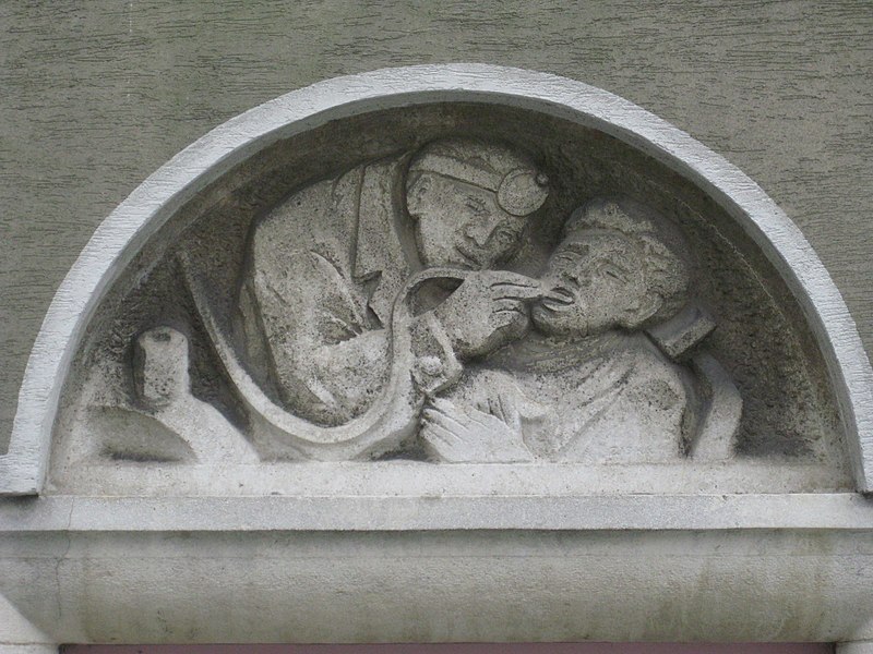 File:1100 Laxenburger Straße 203-217 Stg. 15 - Natursteinrelief Dentist von Elisabeth Ziska IMG 7459.jpg