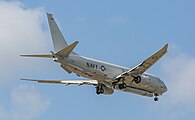 A Boeing P-8 Poseidon, tail number 168996, on final approach at Kadena Air Base in Okinawa, Japan. It has an AN/APS-154 Advanced Airborne Sensor (AAS) mounted underneath it.