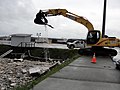 397 Excavator lifts debris from harbor (15122515105).jpg