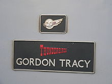 Gordon Tracy name plate on a Virgin Trains 57304 57304 Gordon Tracy at Crewe 02.jpg