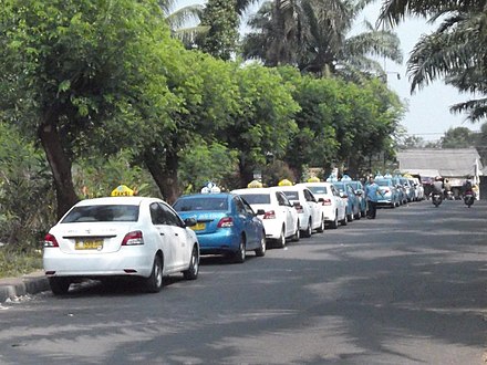 More abundant taxis, 5 Express taxis (white) and 6 BlueBird taxis (blue) waiting for order