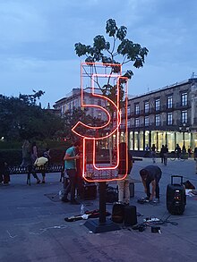 A "5J" sculpture made of rod and LED lights.