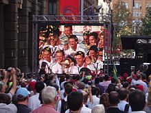 A large crowd of over 10,000 fans welcome the Australian team on completing the first World Cup hat-trick – Martin Place, Sydney.