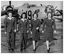 WASP pilots (left to right) Eloise Huffines Bailey, Millie Davidson Dalrymple, Elizabeth McKethan Magid and Clara Jo Marsh Stember, with a B-24 in the background