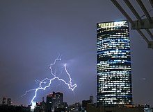 Lightning in the background of the Torre Mayor