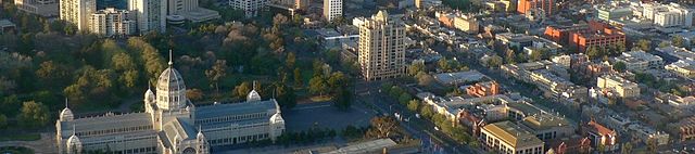 Aerial view looking south over Carlton. The Royal Exhibition Building and Carlton Gardens (left), Rathdowne Street (centre), Drummond Street (right) a