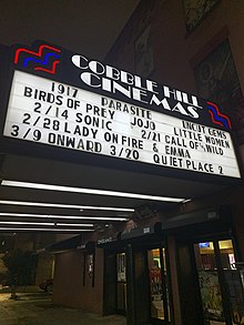 A Brooklyn cinema announcing its showings in February 2020; A Quiet Place Part II's release was subsequently postponed. Cobble Hill cinema, Brooklyn (49571450227).jpg