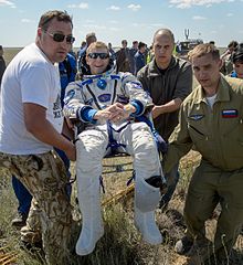 Peake being carried to a medical tent shortly after the landing of Soyuz TMA-19M Expedition 47 Soyuz TMA-19M Landing (NHQ201606180004).jpg