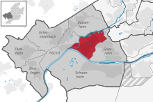 Kort, der lokaliserer distriktet (i rødt) i bydelen (i mørkegrå) og resten af ​​byen (i lysegrå)