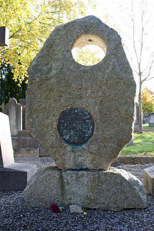 Grave of Brendan Behan by Clíodhna Cussen, Glasnevin, Dublin. A bronze likeness of Brendan's face was stolen from the vacant opening in 1984. It was r