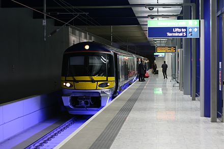 Heathrow Express train prepares to depart from platform 3 at Heathrow Terminal 5 station with a service to London.