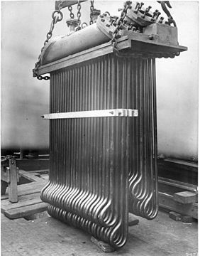 Superheater of a Lancashire boiler 1900, for the extraction of heat from waste gasses, and transfer of heat to saturated steam passing from the boiler to the steam range or engine. This raised the overall thermal efficiency of the plant, and would also prevent damage from slugs of condensate by ensuring the saturated steam was dry and not wet.[98]
