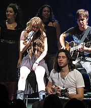 Cyrus performing "These Four Walls" during the Wonder World Tour Hoedown Throwdown Wonder World.jpg