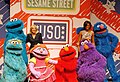 Jill Biden and Michelle Obama pose with some of the cast of Sesame Street, 2011.jpg