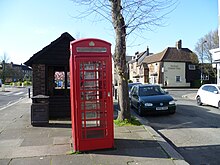 The nearby grade II listed K6 telephone kiosk. K6 telephone kiosk, Cannon Hill, Southgate.JPG