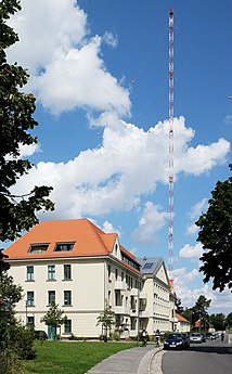 Former radio barracks and the mast 17