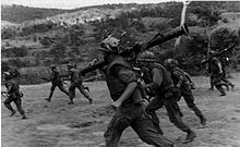 Marines rush across a field during Operation Lancaster II.jpg