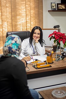 A doctor meeting with her patient in Egypt. Doctors develop a close relationship with their patients in order to build trust and better diagnose and treat disease. Meet My Doctor.jpg