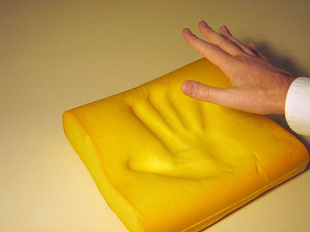 Memory foam with a slower springback than the foam above. Note characteristic polyurethane yellowing caused by light exposure.
