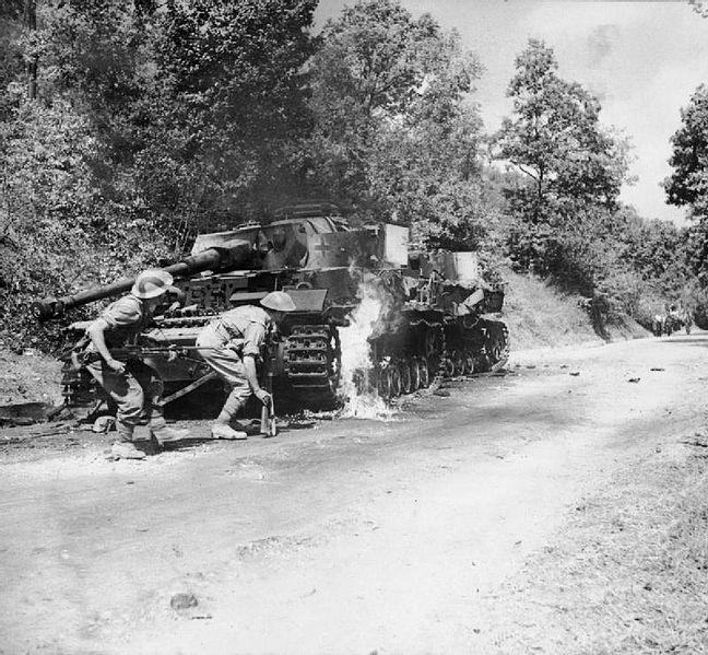 File:Men of the 2-6th Queens's Regiment advance past a pair of burning German PzKpfw IV tank in the Salerno area, Italy, 22 September 1943. NA7137.jpg