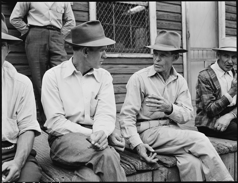 File:Miners on the front porch of the company store on a Sunday morning payday. P V & K Coal Company, Clover Gap Mine... - NARA - 541328.tif