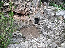 The entrance of Wind Cave in South Dakota, US Natural entrance to Wind Cave (Black Hills, South Dakota, USA) 1.jpg