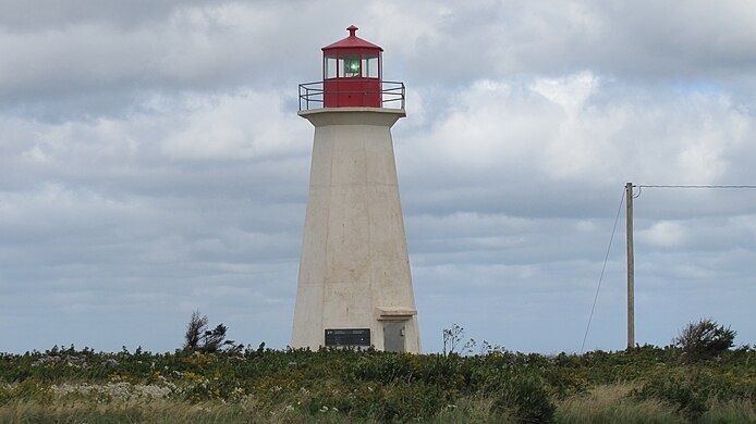 Shipwreck Point Lighthouse, overlooking Naufrage Harbour and the Gulf of St. Lawrence. Naufrage Lighthouse, Prince Edward Island (471398) (9448034123).jpg