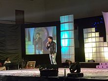 Papu Pam Pam performing standup comedy during Ganesha Puja in Bangalore in 2011 Papu Pam pam Bengaluru Odia Ganesa Puja1.JPG