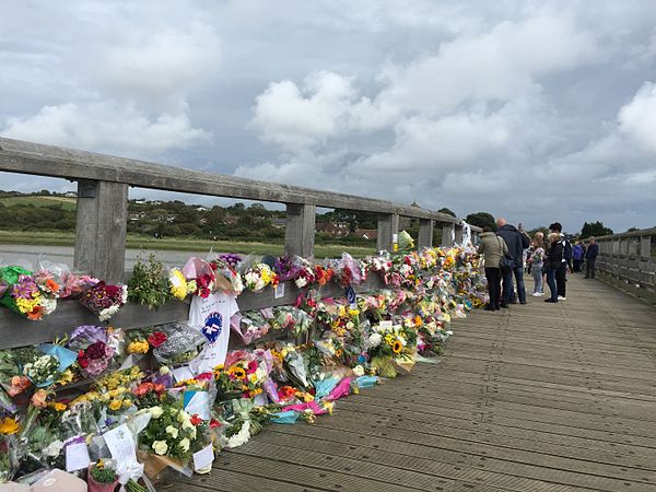 Floral tributes to those who died, on Shoreham Tollbridge near the site of the crash