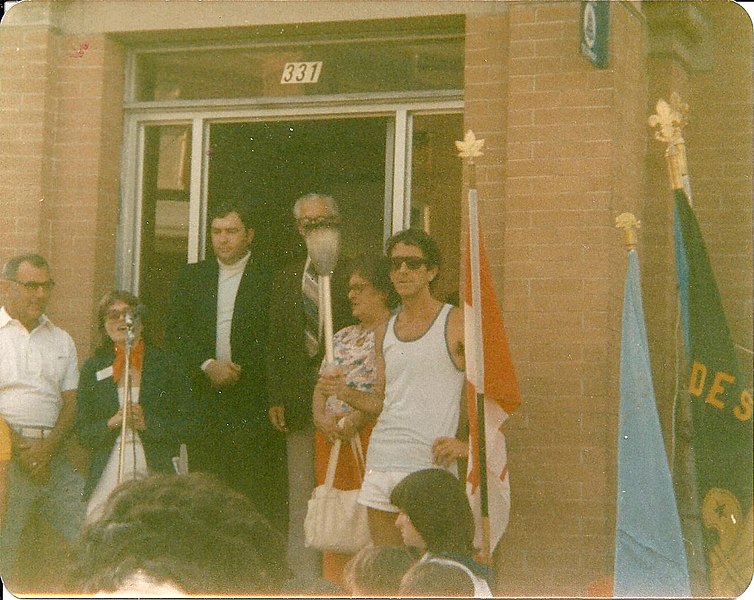 File:Photograph of people standing on the Town Hall steps in Deseronto, Ontario. The event is believed to be the first Terry Fox Run, held in communities across Canada in September 1981. From right- Jim (16786044981).jpg