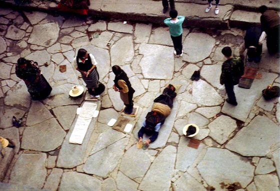 Pilgrims prostrating at the Jokhang, Lhasa