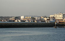 General view of the Muelle Martinez Catena and the Llotja buildings from the marina. Puerto de Isla Cristina.JPG