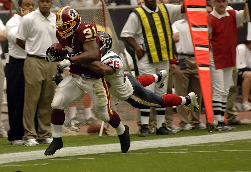 File:Rock Cartwright tackled by Glenn Earl, Washington Redskins vs Houston Texans, September 2006.jpg