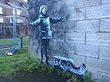 Season's Greetings, a mural by graffiti artist Banksy, stencilled onto a garage in Port Talbot in December 2018. Season's Greetings, Banksy (2).jpg