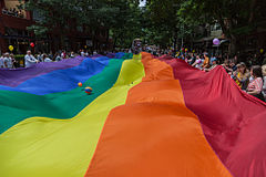 Participants waving a rainbow flag at the 2012 Seattle Pride parade Seattle Pride 2012 (7445340182).jpg
