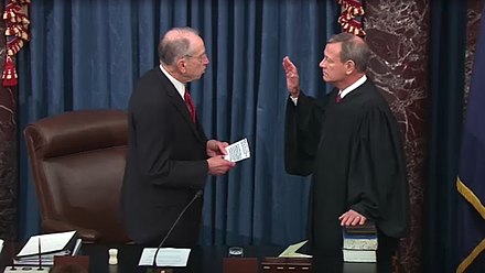 Senator Chuck Grassley (left) administers the oath to Chief Justice John Roberts to serve as presiding officer of the first impeachment trial of Donald Trump