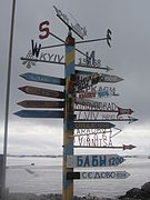 A signpost at Vernadsky Station displays distances to various cities.