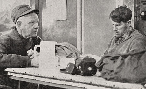 Dufek (left) discusses final plans for the Commonwealth Trans-Antarctic Expedition with Sir Edmund Hillary at Scott Base, 1957.