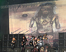 Due to its controversial artwork (pictured in background), all Indian stocks of Christ Illusion were recalled and destroyed. Slayer at The Fields of Rock festival.jpg