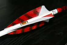 Shield cut straight fletching - here the hen feathers are barred red Spliced feather 0002.jpg