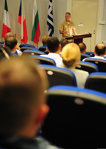 File:U.S. Navy Capt. Bradley D. Martin, the commodore of Task Force 68, addresses a multinational audience during a pre-sail conference for exercise Phoenix Express 2012 May 16, 2012, at the NATO Maritime 120516-N-QD416-143.jpg
