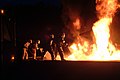 US Navy 030604-M-3856H-032 Firefighters in full gear fight a simulated aircraft fire during a fire fighting training exercise.jpg