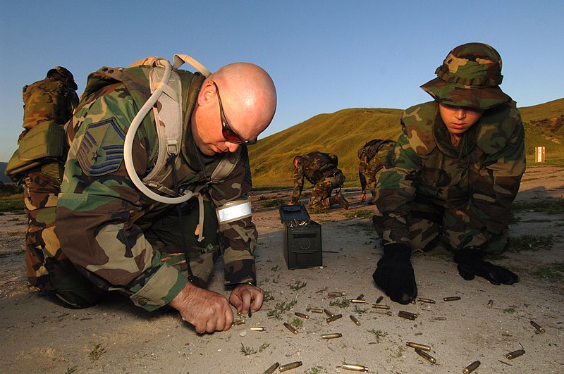 File:US Navy 060419-N-5169H-045 U.S. Air Force Master Sgt. Richard Inman and U.S. Navy Journalist 2nd Class Brooke Armato pick up brass casings after a successful joint force weapons exercise at Camp Pendleton.jpg