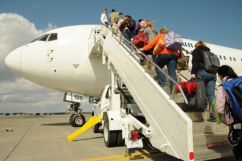 File:US Navy 110323-N-VA590-072 Family members of U.S. military personnel board a flight to the continental United States during an authorized voluntary.jpg