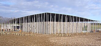 Stonehenge visitor centre. Opened in December 2013, over 2 km (1.2 mi) west of the monument, just off the A360 road in Wiltshire. Visitors' centre Stonehenge.JPG