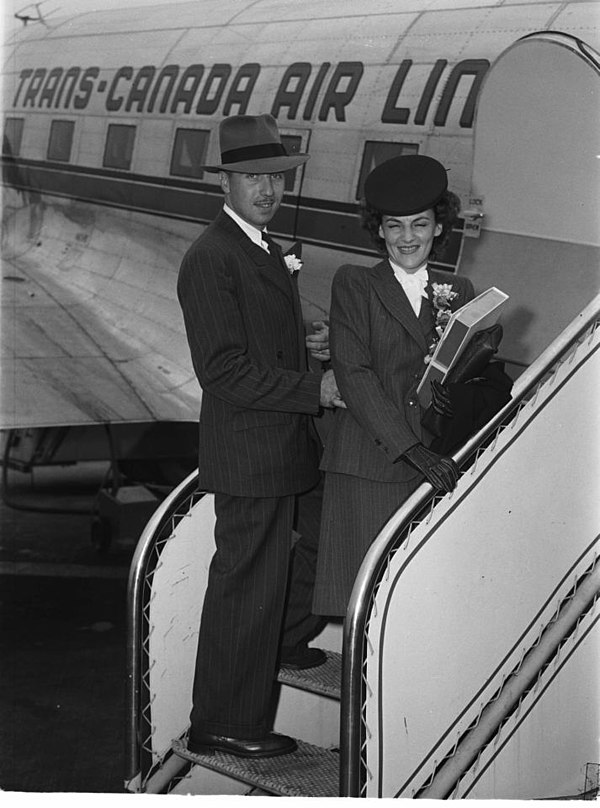 Newlyweds leaving for their honeymoon boarding a Trans-Canada Air Lines' plane, Montreal, 1946